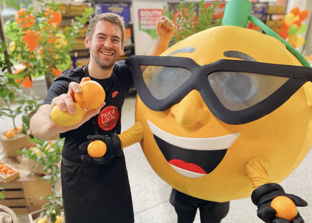 Callum Hann and Mr Squeezy Orange Mascot